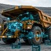 Camión minero de gran tonelaje operando en entorno de minería con interfaces digitales de monitoreo y sistemas de automatización subterránea.
